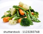 Steamed Vegetables On White...