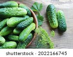 Fresh Cucumbers On A Wooden...