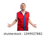 Small photo of Angry man working at hypermarket or supermarket inciting fight with hand gesture and expression isolated on white background
