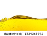 Small photo of Beautiful wave of high viscosity of base oil and air bubble inside the oil isolated on white background. Used in automotive and industrial application. Used as wallpaper, industrial concept