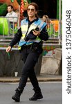 Small photo of Coruna / Spain - April 19 2019: Humourless female police officer glares at the camera in Spain