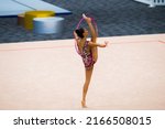 Small photo of GOLD COAST, AUSTRALIA - 17 JANUARY, 2022: Rhythmic Gymnastics Oceania Continental Championship. Gymnast from New Zealand Laylah Waggie doing unsupported vertical split during hoop routine