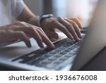 Small photo of Close up image of woman hands typing on laptop computer keyboard and surfing the internet on office table, online, working, business and technology, internet network communication concept