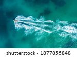 Small photo of Aerial drone photo of stunt man performing extreme stunts with jet ski water craft over the Black sea at dusk