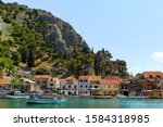 Small photo of Omis, small town, port. Cetina River. Home of pirates. Adriatic coast. Tourist destination. Fortress Mirabella at the peak of the mountain behind the Old town. Cetina canyon. Holiday in Omis. Croatia.