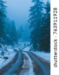 Small photo of A snow covered dirt road winding up to Mount Elden, located in Flagstaff, Arizona.