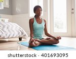 Young Black Woman Doing Yoga At ...