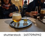 Small photo of Bruges, flanders, Belgium. August 2019. Interior of the historic de garre brewery. A mug of fine craft beer was served with a few pieces of cheese, the tasting takes place in this old-fashioned habit