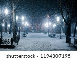 Snow Covered Park In The Evening