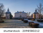 Small photo of Old profane castle building from 1650s, Hasselby slott in its park a sunny frosty winter day in Stockholm, Sweden 2021-12-21
