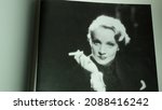Small photo of Rome, Italy - December 05, 2021, detail of an image of the iconic actress Marlene Dietrich in a book dedicated to her, Portraits from 1926 to 1960.