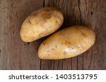 Small photo of Potato heads on old wooden floors