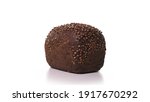 Small photo of beautiful loaf of black bread with sprinkles spinn on white background. Fresh bread, just from the oven on turntable isolated.
