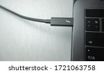 Small photo of Bangkok / Thailand - May 3 2020: Thunderbolt 3(USB-C) port interface cable plug to macbook to transfer data and charge battery