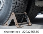 Small photo of Recoil is installed under wheel of truck. Security. Background..