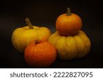 Four Pumpkins Over Black...