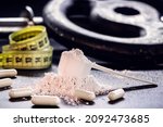Small photo of Sports supplement, creatine, hmb, bcaa, amino acid or powdered vitamin. Sports nutrition concept. bcaa, l-carnitine, creatine