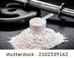 Small photo of Amino acid supplement for sports use, creatine in a measuring spoon, hmb, bcaa, amino acid or powdered vitamin. sports nutrition concept