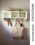 Small photo of Hanging Wall Cubby with Umbrella, Shoes, Tote Bag and Interior Decor