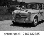 Small photo of URBINO, ITALY - JUN 16 - 2022 : FIAT 1100 103 TV BERLINA 1954 on an old racing car in rally Mille Miglia 2022 the famous italian historical race (1927-1957)