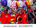 Small photo of Mardi Gras carnival colorful disguise masks, hats, and feathers background.