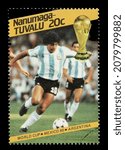 Small photo of Ankara, Turkey - 11,23,2021: A Tuvalu postage stamp shows football player of world championship in Mexico. Circa 1986