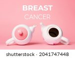 Small photo of Breast Cancer concept. Two white porcelain teapots lying on a pink background. One teapot without a lid, symbolizing the disease.