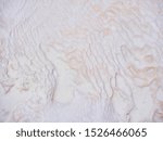Small photo of Undulatory texture of white calcite stalactites covering a cascade of terraced baths in Pamukkale, Turkey. Included in the UNESCO list of natural heritage.