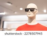 Mannequin in sunglasses on the mall. Portrait of male mannequin and aviator sunglasses.