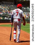 Small photo of Oakland, California - August 10, 2022: Los Angeles Angels outfielder Jo Adell walks to the on deck circle during a game against the Oakland Athletics at the Oakland Coliseum.