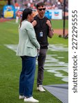 Small photo of August 1, 2022 - San Francisco: Jessica Mendoza and Dave Flemming, MLB announcers and Stanford graduates, talk on the field before a game between the San Francisco Giants and Los Angeles Dodgers.