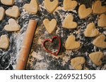 shortbread cookie cutter and rolling pin on a floured table