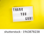Small photo of Lightbox with text message THANK YOU GOD isolated on yellow background. Concept of happiness, prayer, faith, hope, gratitude, gratefulness, survive, luck, chance, godsend, pleased, Thanksgiving Day