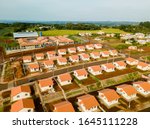 Aerial view of a housing estate (popular houses) in Paraná, Brazil.