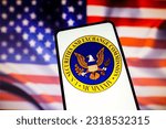 Small photo of June 16, 2023, Brazil. In this photo illustration, the United States Securities and Exchange Commission (SEC) logo is displayed on a smartphone screen with a United States flag in the background