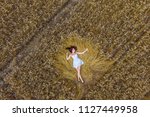 Young Girl In A Wheat Field....