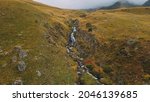 misty mountain and river aerial | Shutterstock . vector #2046139685