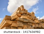 stacked lumber on blue sky... | Shutterstock . vector #1417636982