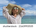 a happy woman is resting on the ... | Shutterstock . vector #2163993535