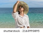 a happy woman is resting on the ... | Shutterstock . vector #2163993895