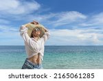 a happy woman is resting on the ... | Shutterstock . vector #2165061285
