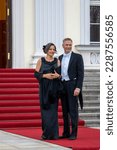 Small photo of Berlin, Germany - March 29, 2023: the CEO of Rolls Royce Germany Dirk Geisinger with Gesine Eisfeld on the red carpet in front of Bellevue Palace on occasion of the state banquet for King Charles III.