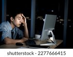 Tired staff officer put head on hands during work with desktop computer, feel sleepy after has overwork project overnight but try to not fall asleep, exhausted businessman work hard overtime at night.