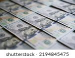 Small photo of US one hundred dollars bills money line pattern, close up