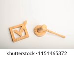 Small photo of Checkbox and hammer of the judge. Check mark. The concept of a judicial decision. Referendum and electoral process. Resolution, approval of the bill. Imposition of sanctions. Elections.