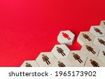 Small photo of A man leaves a formation of people figurines hexagons. Violation of the integrity of the system, non-conformist. Integration of a person into society. Staff recruitment, recruiting. Exception from