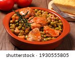 Small photo of Turkey meat with pea garnish in tomato sauce. Bowl with very delicious food.