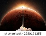 Small photo of Successful space shuttle rocket launch with smoke and light blast flies to the red planet mars at sunset. New spaceship takes off up to the red planet in starry sky. Science and technology, concept