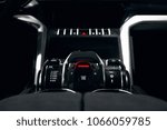 start and stop button at dark car interior 