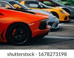 Supercars at the parking lot. Track day at the race track. Fast cars prepared for ride at the raceway